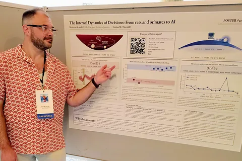 Nathan M. Thornhill pointing at his poster, Poster #530, at The Science of Consciousness 2026 in San Diego